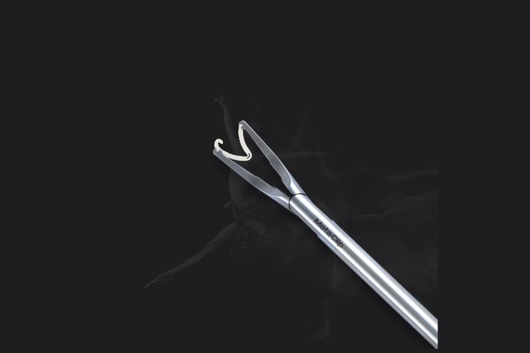 MetaClip-P polymer ligating clip in an applier jaw